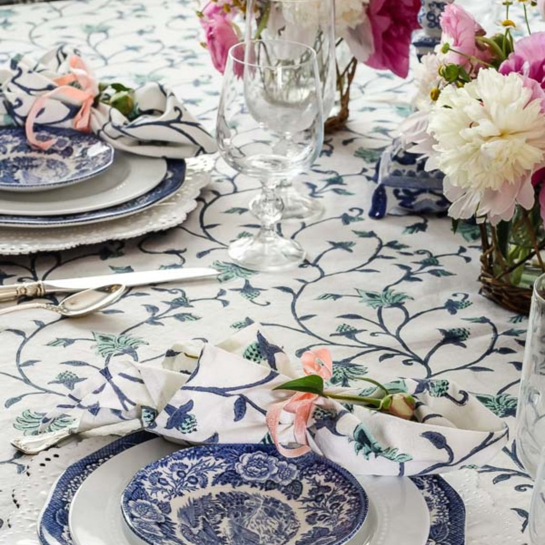 Large square cotton tablecloth featuring hand block printed blue and green floral country style pattern for special gatherings with large size napkins in same pattern