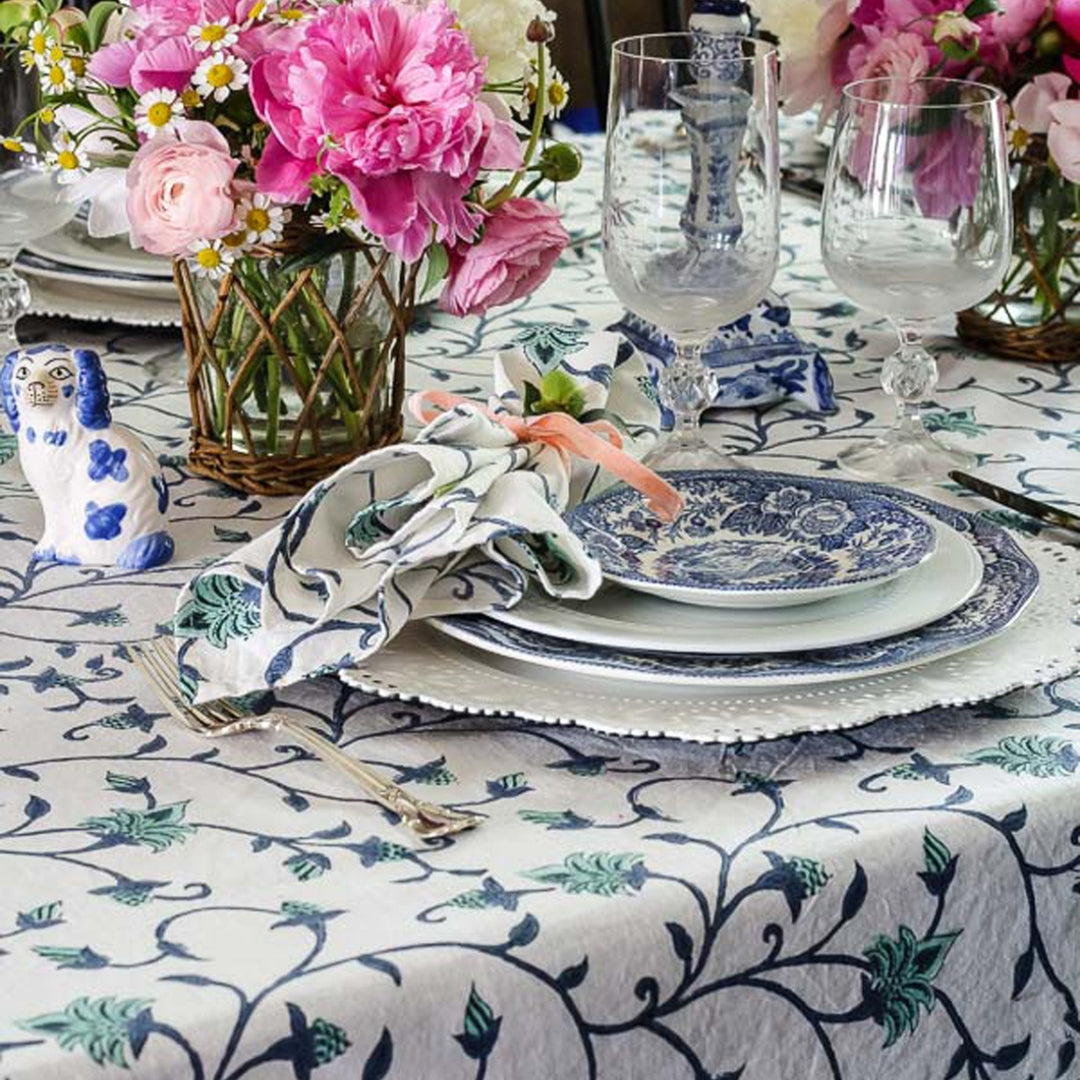 Hand block printed cotton table napkin set of 4 of 18 inch size displayed over large rectangular table linen