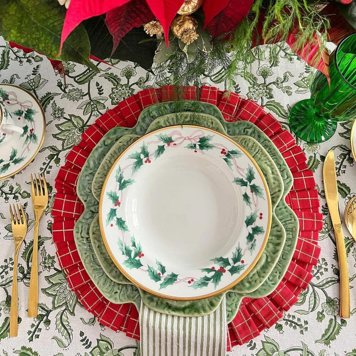 Detail shot of  hand block printed monochrome green floral country style pattern in Christmas setting