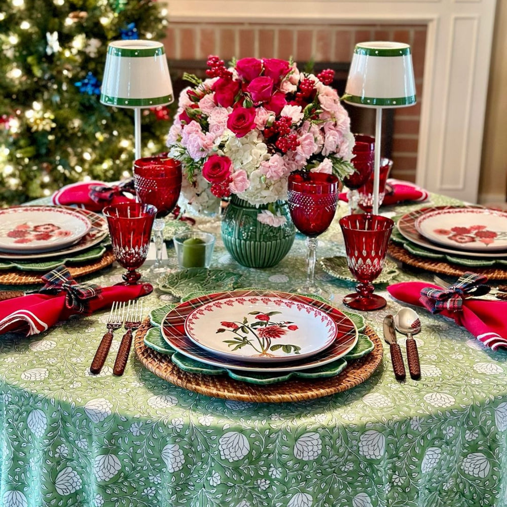 Large round cotton tablecloth featuring hand block printed green and white floral country style pattern in Christmas Table setting