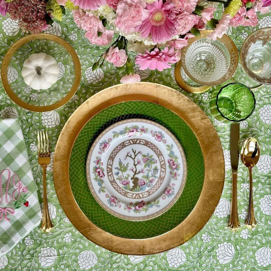Detail shot of Green and white Hand block printed tablecloth set for Thanksgiving dinner on a large square table