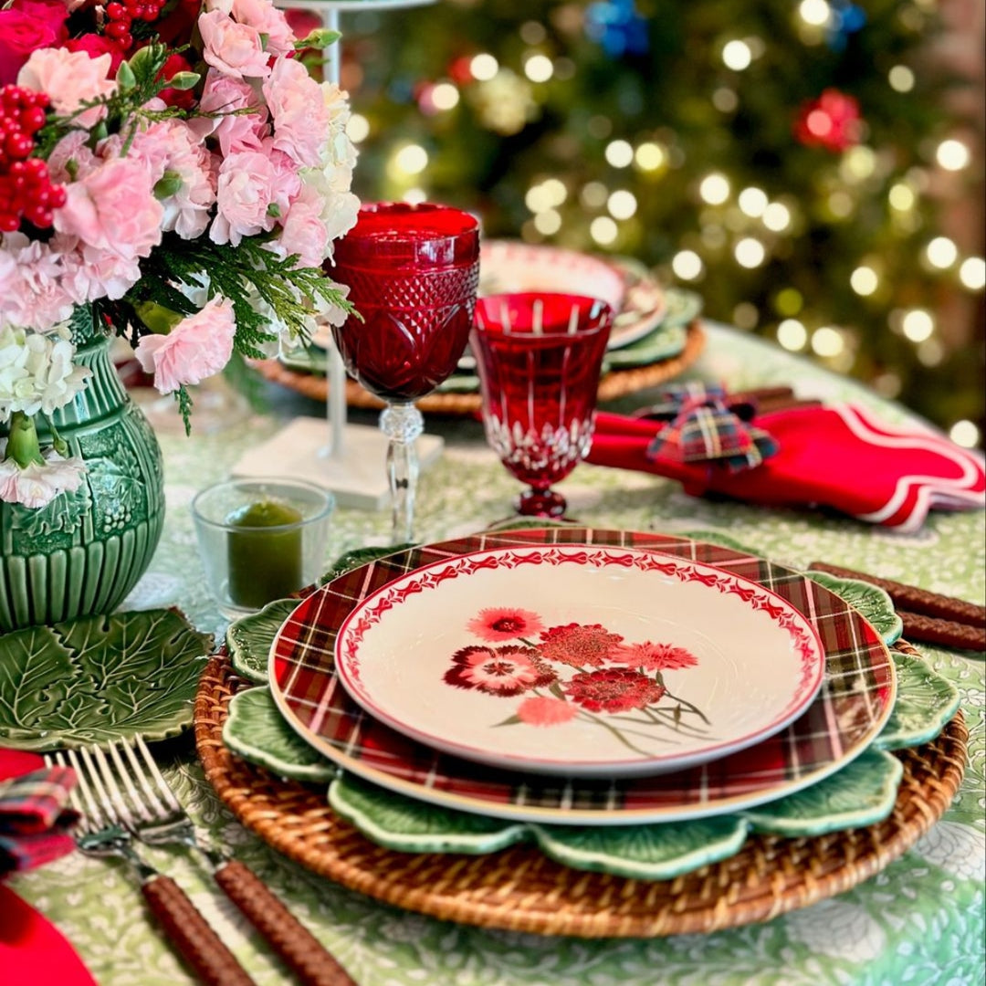 Detail shot of large size round cotton tablecloth featuring hand block printed green and white floral country style pattern in Christmas Table setting
