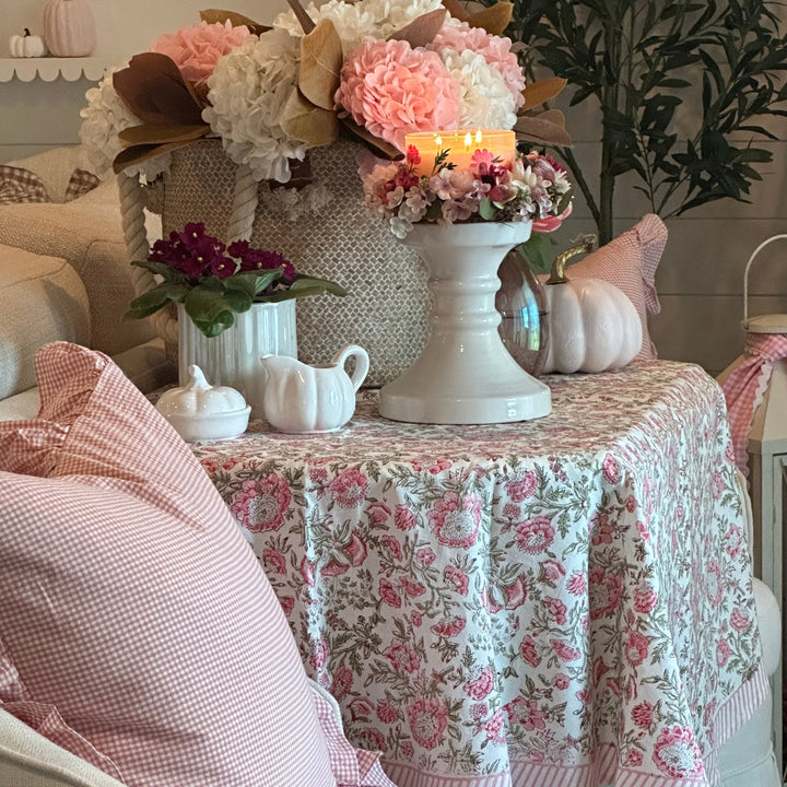 Pink floral Fall tablecloth with fall decor accents.