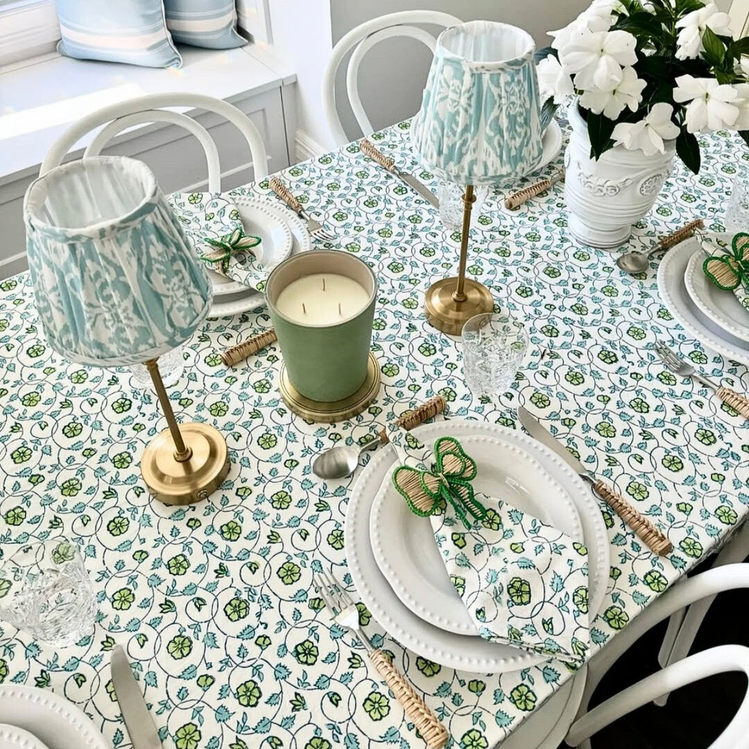 Detail shot of Blue and Green hand block printed tablecloth set on a large square table for Christmas gathering