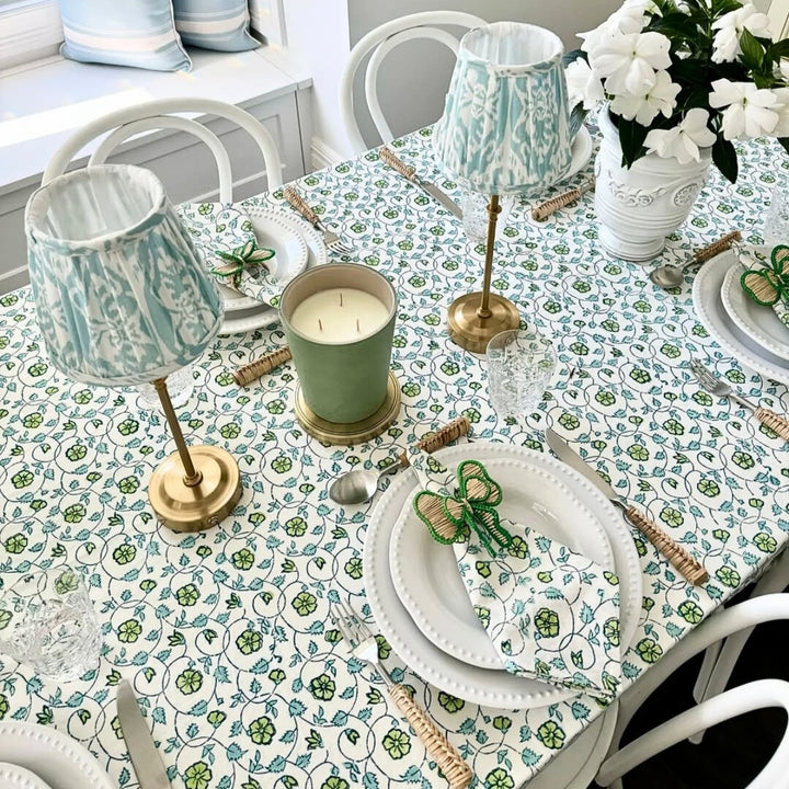 Detail shot of Blue and Green hand block printed tablecloth set on a large square table for Christmas gathering