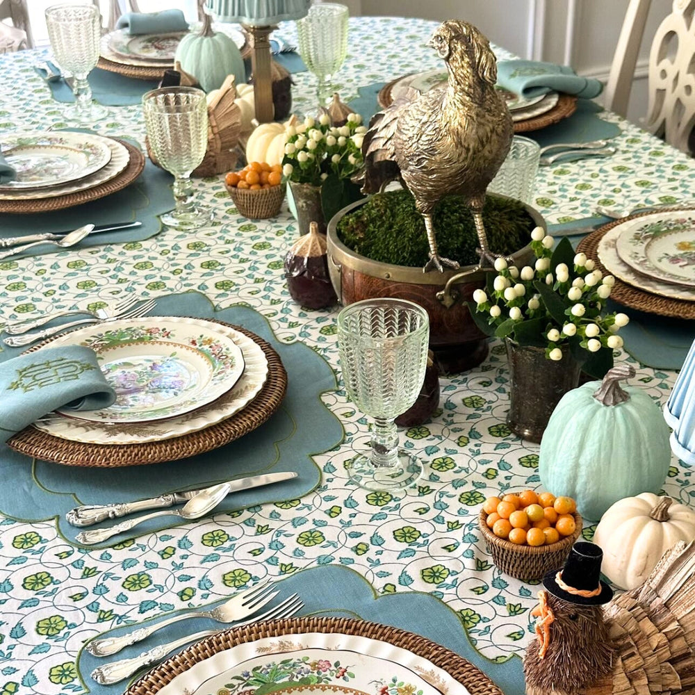 Blue and Green hand block printed tablecloth set on a large square table for Thanksgiving gathering