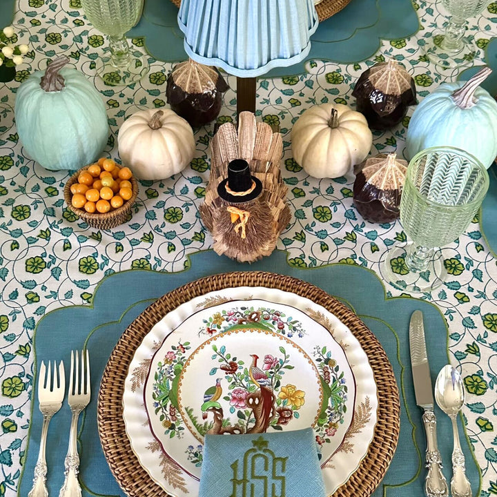 Detail shot of Blue and Green hand block printed tablecloth set on a large rectangular table for Thanksgiving gathering