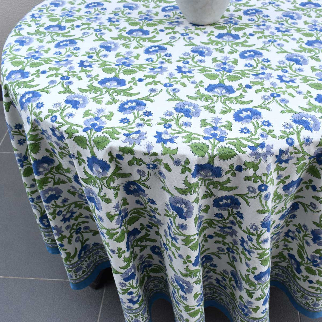 Detailed shot of 70 inch round table cover showing hand block printed floral pattern and fabric texture