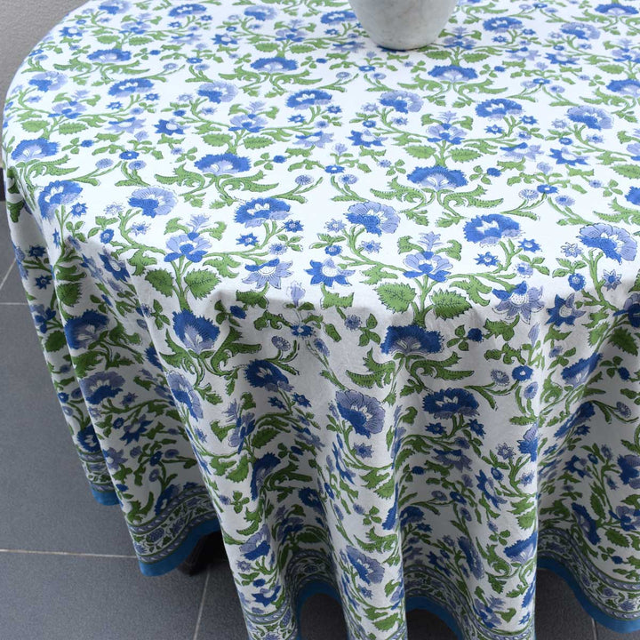 Detailed shot of 70 inch round table cover showing hand block printed floral pattern and fabric texture
