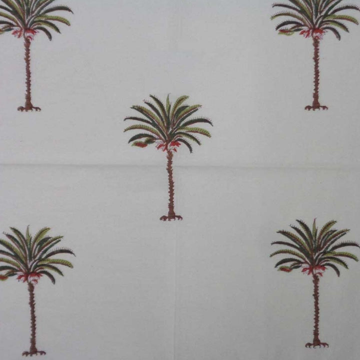fabric table napkin featuring green palm design on a premium cotton fabirc.