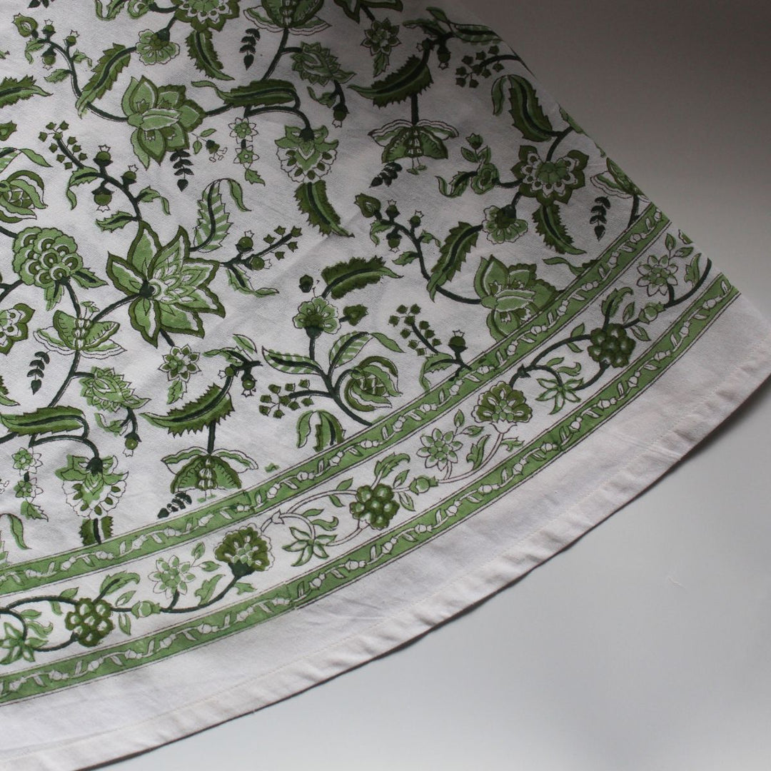 detail floral pattern shot of hand block printed 60 inch green round cotton tablecloth